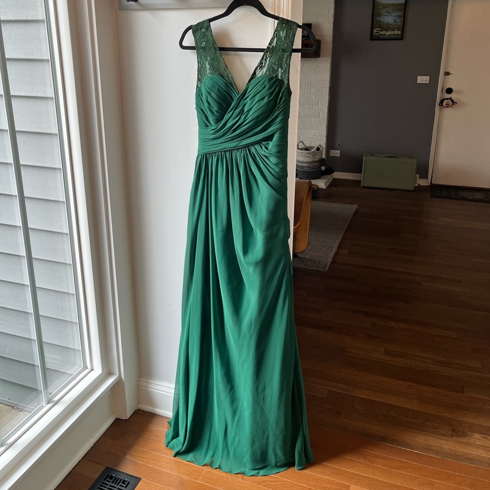 Green formal gown 60” long with ruched skirt. Size 10 but fits like a size 6.